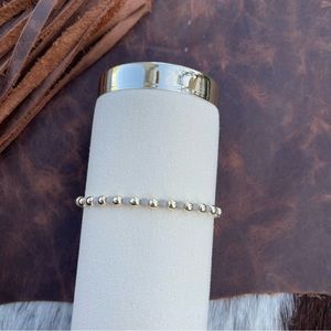 Gray and 14kt gold plated beaded bracelet